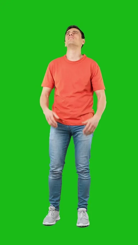 Desperate man in studio against chroma key Stock Footage 244075456