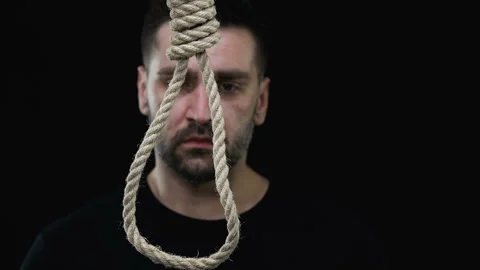 Desperate man wearing loop on neck, suicide prevention concept, risk of death Stock Footage 108010446