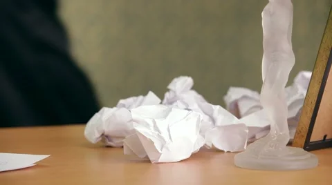 Desperate Move. Whisk by hand from the table crumpled sheets of paper Video stock 67576587