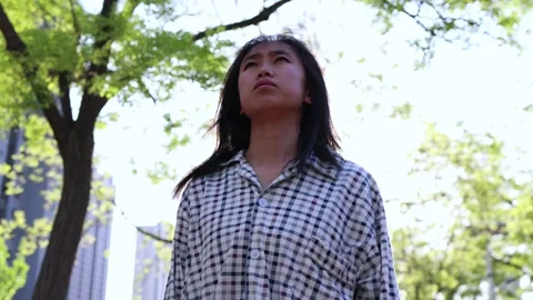 Desperate sad patient looking up to the sky and sighing in sunlight Stock Footage 245253985