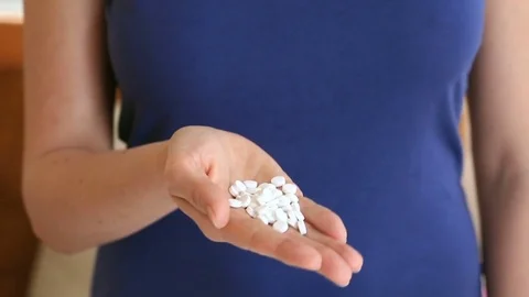 Desperate woman attempts to commit suicide with pills. When provoking suicide Video stock 75906207