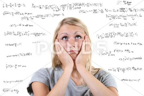 Desperate woman with many mathematical equations around her Stock Photos