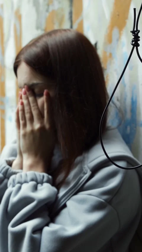 A desperate young girl prepares to commit suicide by hanging. Suicide. 스톡 동영상 313171458