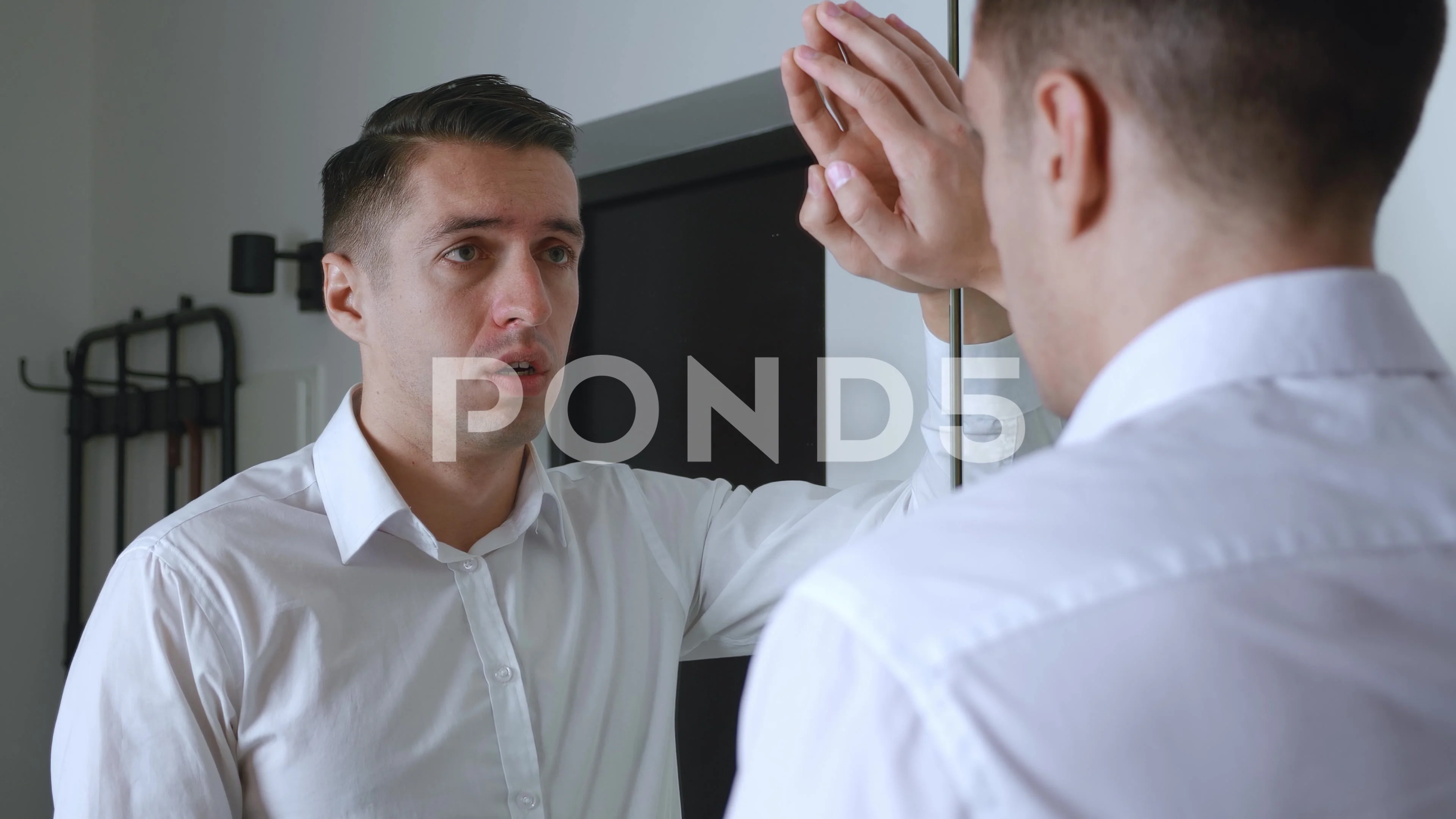 man looking in mirror