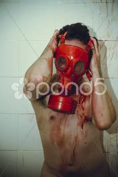 Desperation naked man with red gas mask, blood, despair and suicide Stock Photos