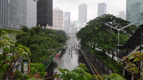 Despite the rain easing, people remain enthusiastic - 20250210 095704978 Stock Footage 301867374