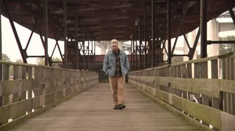 Despondant man walking Stock Footage