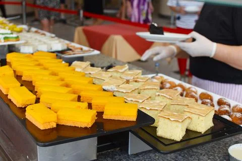 Dessert cake on table in restaurant. many sweet treats at  buffet table. maki Stock Photos