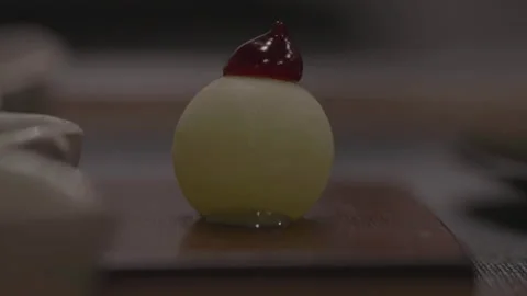 Dessert close-up with small cream ball 库存影片 335703232
