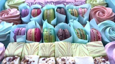 Dessert French Macarons in a present box. Sweet dessert on a pink background. 스톡 동영상 250092914