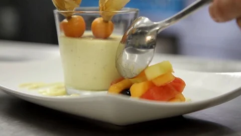 Dessert getting finalized with full spoon of fruits Stock Footage 123394590