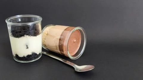 Dessert jars with one jar lying on its side Stock Photos