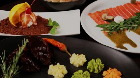 Dessert, main course and appetizer on the table Stock-Footage 328188622