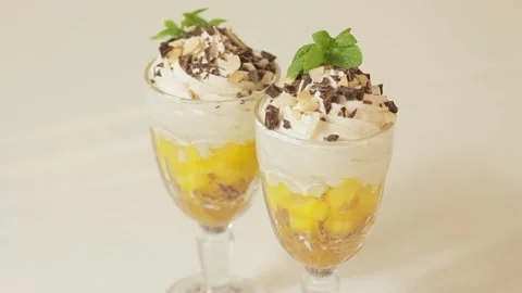 Dessert with mango and cream Stock Footage 239920882