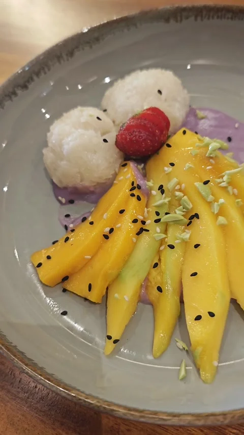 Dessert mango in a plate Stock Footage 339076520