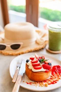 Dessert menu strawberry timber ring with drinks in the cafe Stock Photos