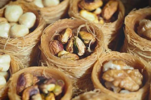Dessert with nuts in small round pastries served at a gathering Stock Photos