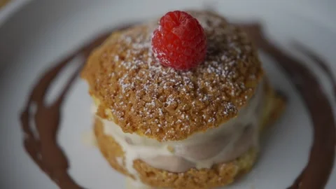 A dessert with a raspberry on top Stock Footage 301518110