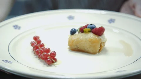 Dessert rum baba with berries and mint. Stock Footage 113848131