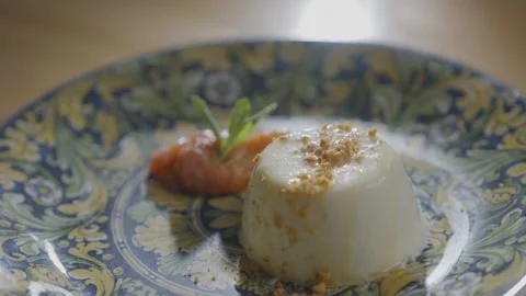 A dessert with a sauce and a leaf on top of it Stock Footage 306043672