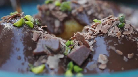 Dessert served with chocolate and nuts on a plate Stock Footage 342381500