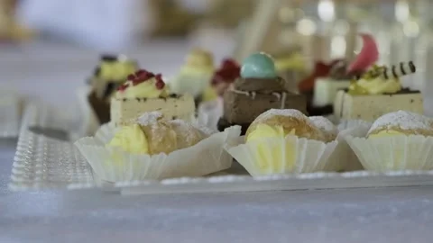 Dessert Spread, Table at Wedding. Variety of Sweet Treats, Dessert Buffet Stock Footage 258946015