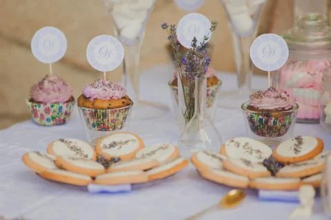 Dessert table for a wedding party. Biscuits decorated with lavanda flowers Stock Photos