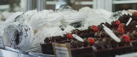Desserts in a cafe shop window display Stock Footage 152582928