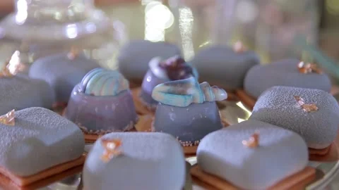 Desserts lying on the table, served for the buffet, blue icing on the cookie Stock Footage 132697158