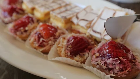 Desserts on party tray with handheld camera B Stock Footage 124084183