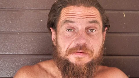 Destitute man talks on the camera 스톡 동영상 115947973