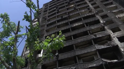 Destroyed and burned down after artillery shelling of a multi-storey residential Video stock 196906818