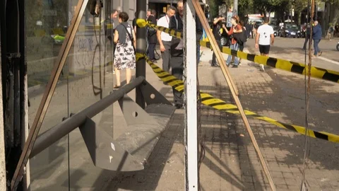 Destroyed and burnt bus stop after mass protests in Barcelona. Video stock 125643162