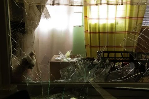 A destroyed apartment after a drone exploded under the window of a multi-st.. Stock Photos