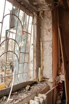 A destroyed apartment after a drone explosion under the window of a multi-s.. Stock Photos
