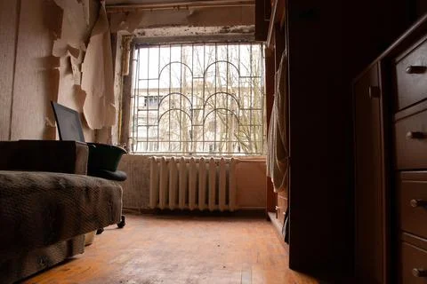 A destroyed apartment after a drone explosion under the window of a multi-sto Stock Photos