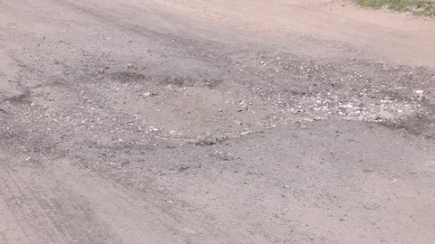 Destroyed asphalt pavement of the road Stock Footage 316516115