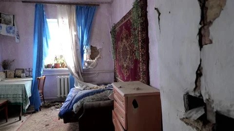 Destroyed bedroom of a house from a shell fired by Russian troops 動画素材 196875845