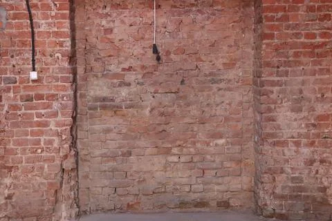 Destroyed brick wall blurred background close up 스톡 사진