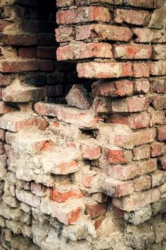 Destroyed brick wall. The foundation of the old building. Stock Photos