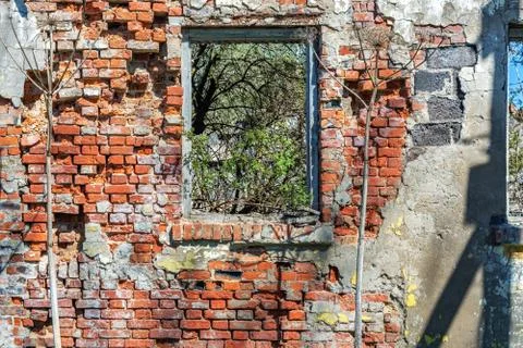 Destroyed brick wall. Stock Photos