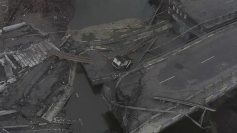Destroyed bridge across the Irpin river. Evacuation of city dwellers. Stock Footage 179976830