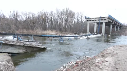 A destroyed bridge during hostilities in Ukraine. Izyum, Kharkiv region Stock Footage 239434232
