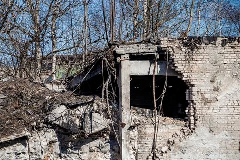 Destroyed building. Break in a brick wall. Demolition of old house. Stock Photos