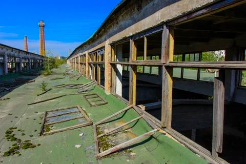 The destroyed building of the factory workshop, which worked in the defense i Stock Photos