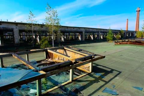 The destroyed building of the factory workshop, which worked in the defense i Stock Photos