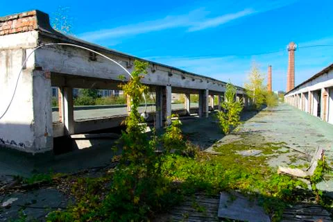 The destroyed building of the factory workshop, which worked in the defense i Stock Photos