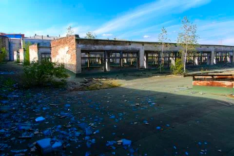 The destroyed building of the factory workshop, which worked in the defense i Stock Photos