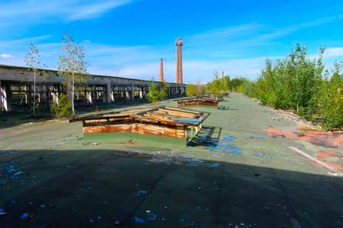 The destroyed building of the factory workshop, which worked in the defense i Stock Photos