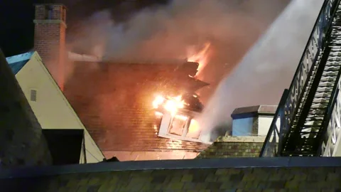 Destroyed building by heavy flames Stock Footage 139657456
